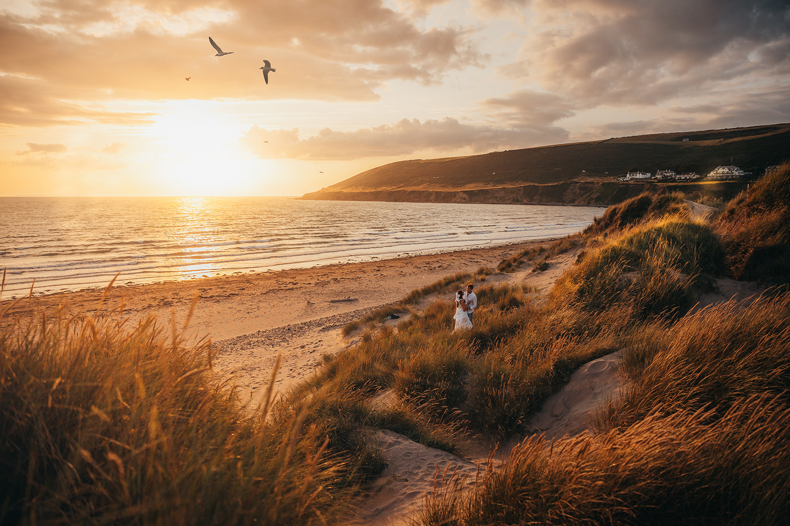 couple on beach at sunset